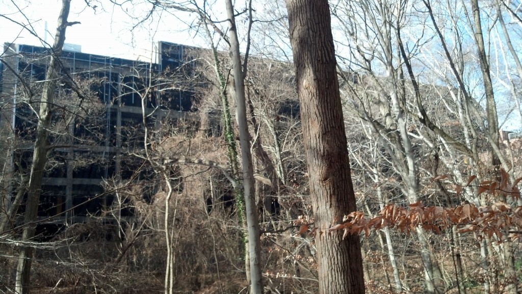 The Van Ness Square building at the edge of Soapstone Valley undergoes demolition.